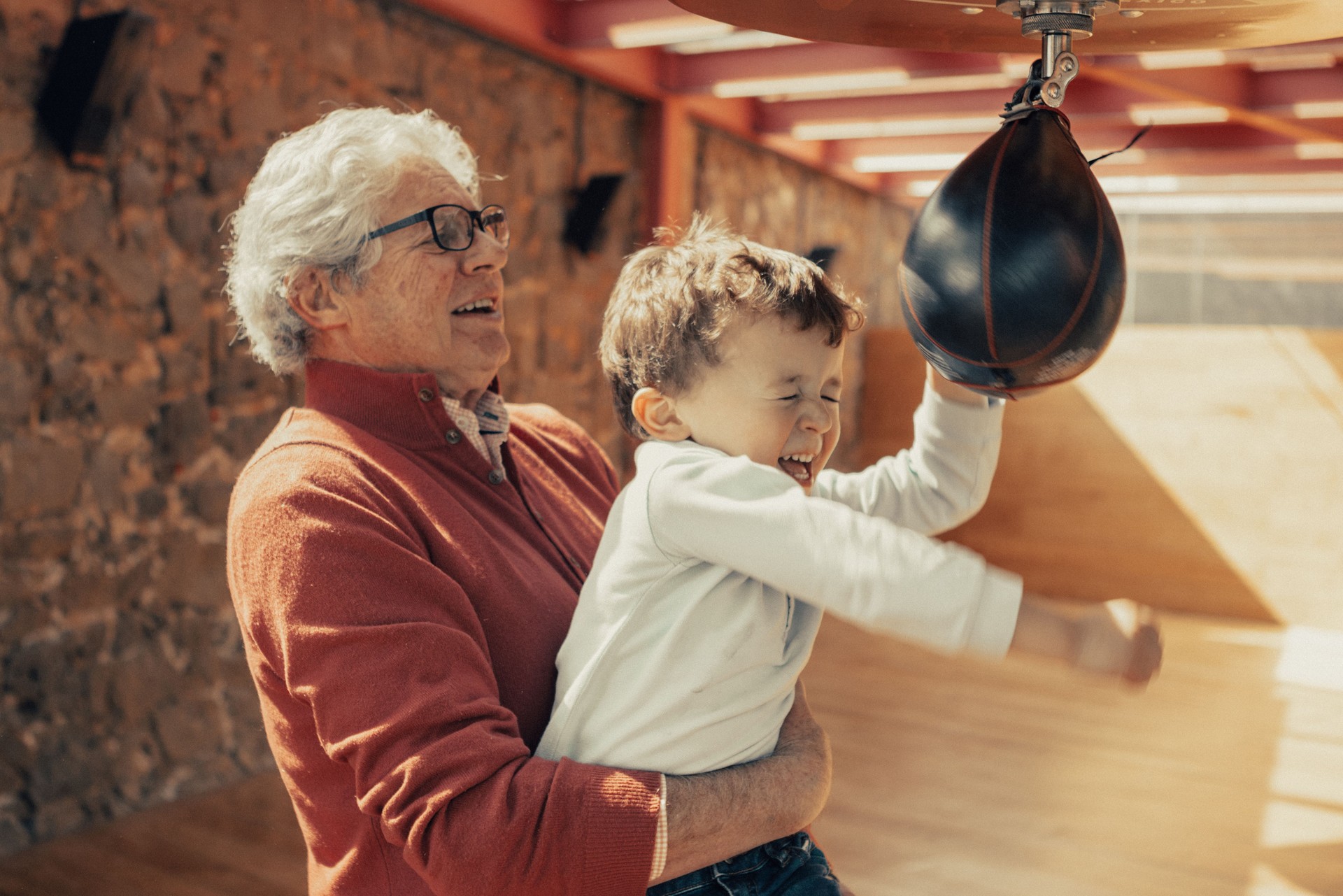 Granfather teaching granson boxing